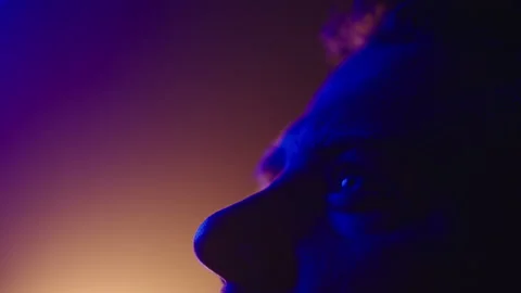 Side Profile of Man with Colourful Lights Video stock 154147192