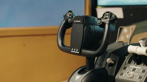 Side Profile Pan to Boeing Flight Stick in Museum Simulator Stock Footage 337162065