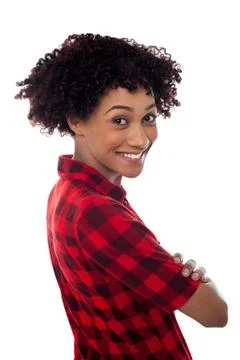 Side profile of slim young smiling woman, arms crossed Stock Photos