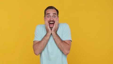 Side profile view fun young man in basic casual blue t-shirt turn to camera Stock Footage 148283041