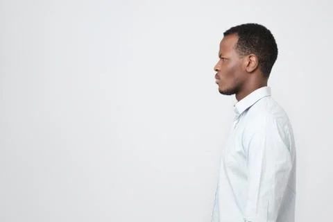 Side profile view portrait of smart african young man looking aside Stock-Fotos