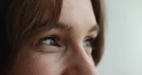 Side profile view upper face of woman staring into distance Stock Footage 220171348