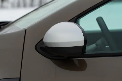 Side rear-view mirror on a modern car. Closeup photo of  a car mirror. Close  Stock Photos