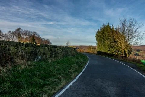 Side road captured during early morning sunset with nice sky, clouds and colo Фото