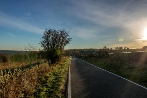 Side road captured during early morning sunset with nice sky, clouds and colo Stock-Fotos