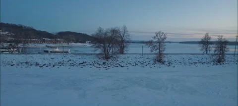 Side Scrolling View Of Hudson Dike On The Frozen St. Croix River In Hudson WI Stock Footage 229761562
