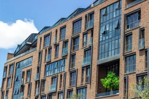 Side shoot of brick and open glazing facade office building Stock Photos
