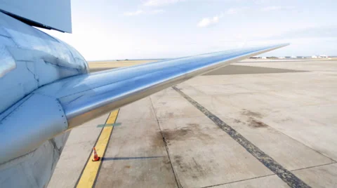 Side shot of airplane's wing on a runway Stock Footage 37177858