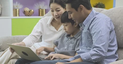 Side shot of family using computer. Stock Footage 120426412