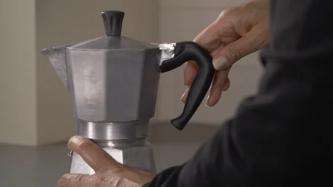 Side shot- italian coffee maker closing the espresso maker 4k Stock Footage 96144541
