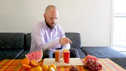 Side shot Man counting vitamins and thinking Stock Footage 112035927