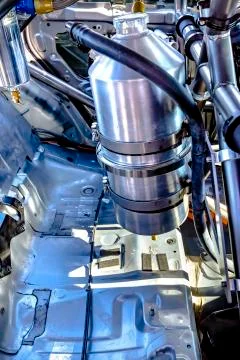 Side shot of nitrous oxide in the back of a stripped rally car Stock Photos