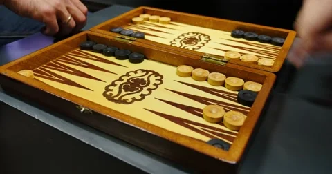 Side shot of two people playing the backgammon Stock Footage 55325473