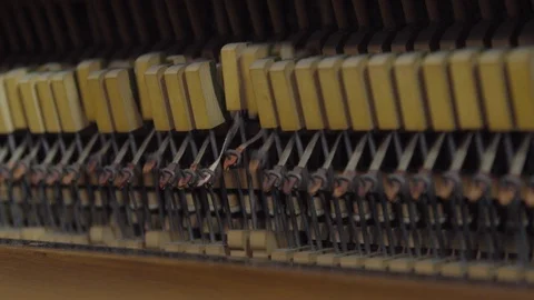 SIDE ON SHOT OF AN UPRIGHT PIANO BACK CHECK MOVING HAMMERS Stock Footage 126418043