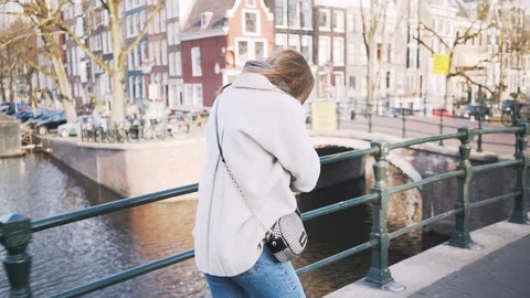 Side shot of a young hipster business woman working with her laptop outside Stock Footage 127292853