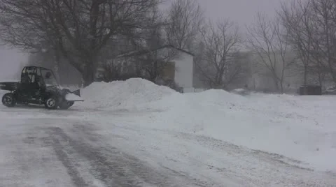 Side by Side Changes Blade Angle before Plowing Stock Footage 21432337