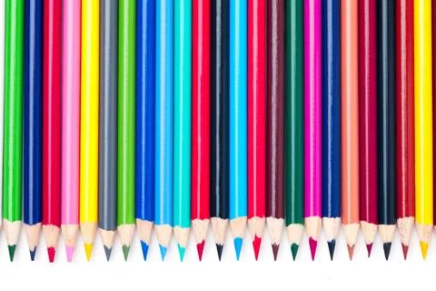 Side by side multicolored pencil crayons Stock Photos