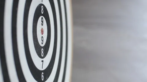 Side сlose up of playing darts on black-white dartboard Stock Footage 95600774