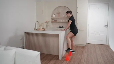 Side Step Overs with Cones and Unilateral Counter Support Stock Footage 314188918