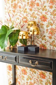 Side table with flowers and interior decoration Stock Photos