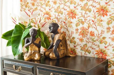 Side table with flowers and interior decoration Stock Photos