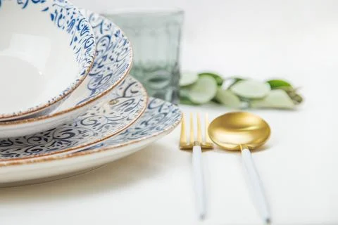 On the side there is a set of plates of different sizes with a white middle and Stock Photos