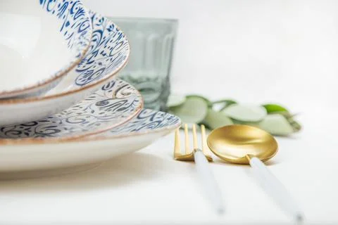 On the side there is a set of plates of different sizes with a white middle and Stock Photos