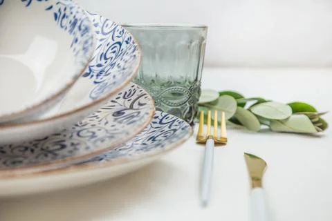 On the side there is a set of plates of different sizes with a white middle and Stock Photos