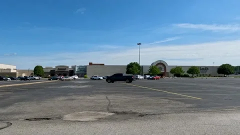 Side tracking camera movement during car movement in large parking lot Stock-Footage 202106196