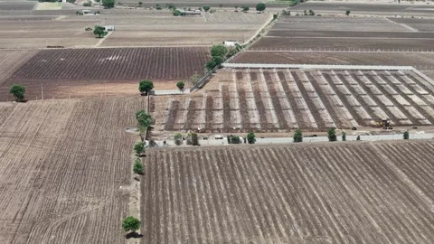 Side tracking high altitude drone shot documenting a heavy civil engineering Vídeo Stock 337479057