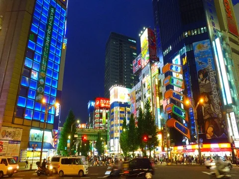 Side tracking shot of Akihabara shopping area Tokyo Japan at dusk Stock Footage 80851178