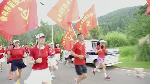 Side tracking shot of waving red flags Stock Footage 341738497