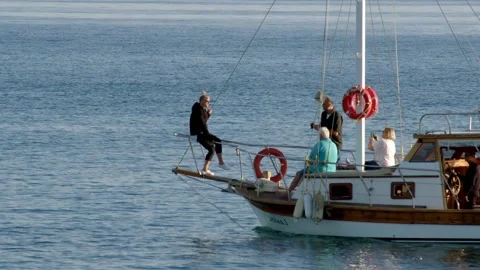 Side, Turkey - CIRCA 2022: Close up pleasure boat with people with Turkish flag Stock Footage 228133288