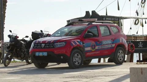 Side, Turkey - CIRCA 2022: red police car Dacia Duster in city of Side drive Stock Footage 224387988