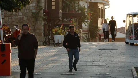 Side, Turkey - CIRCA 2022: View of tourist part of the old city town at sunset Stock Footage 231111912