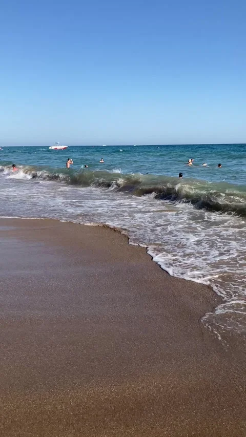 Side, Turkey, June 30, 2025. A beautiful sunny beach day filled with joyful swim Stock Footage 313998468