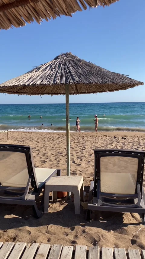 Side, Turkey, June 30, 2025. Sunny beach day filled with joyful swimmers Stock Footage 314083904