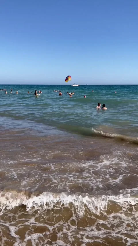 Side, Turkey, June 30, 2025.  beach filled with joyful swimmers on the sea coast Stock-Footage 314116302