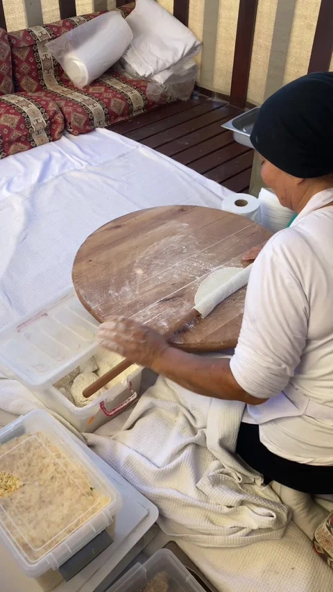 Side, Turkey, June 30, 2025. Turkish woman makes traditional Turkish flatbread. Stock-Footage 314972171