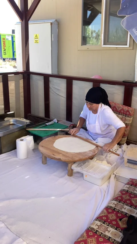 Side, Turkey, June 30, 2025. Turkish woman rolling out dough  Stock Footage 314972172