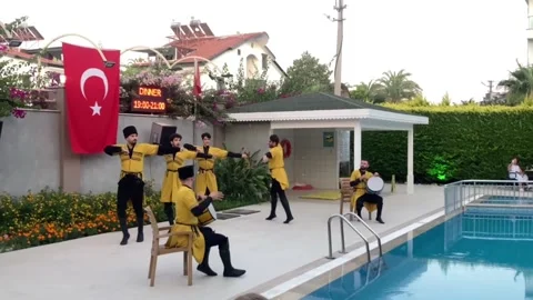 Side, Turkey, June 30, 2025. Turkish male dancers in yellow national costumes Stock Footage 320286112