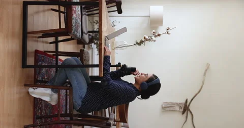 Side vertical view Indian radio host woman talks into microphone Video stock 220173536