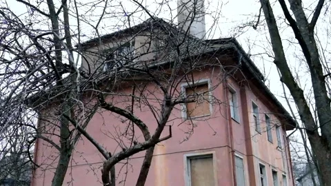 Side view of an abandoned mansion and garden next to it Stock Footage 180655505