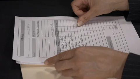 Side view - accountant sorting invoices and forms 4k. Stock Footage 96017643