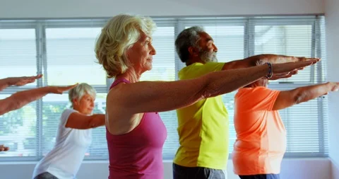 Side view of active mixed-race senior people exercising in the fitness studio 4k Stock-Footage 107022856