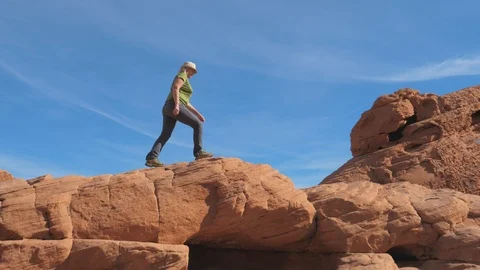 Side View A Active Woman Climbs The Red Rocks Up Background The Sky Stock Footage 90889341