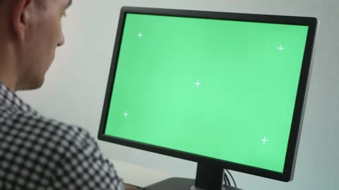 Side view on adult man looking at monitor with chroma key screen Stock Footage 154553924