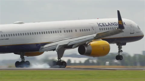 Side on view of airplane landing Stock Footage 63869699