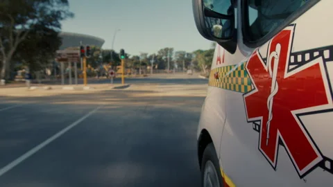 Side view of An ambulance driving fast in the city Stock Footage 278785649
