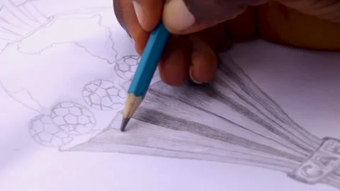 Side view of an artist drawing a trophy Stock Footage 201580683